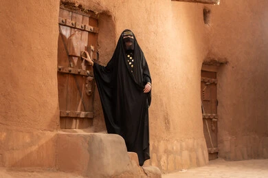 Saudi Woman in Traditional Dress at Heritage Site