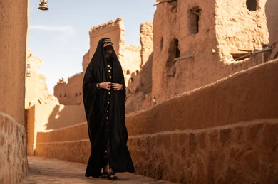 Saudi Woman in Traditional Abaya at Heritage Village