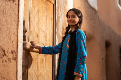 Saudi Girl in Traditional Dress at Heritage Site