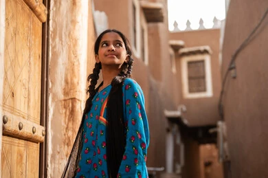 Saudi Girl in Traditional Dress at Heritage Site
