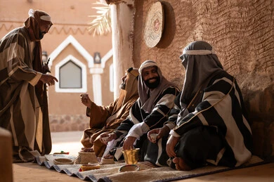 Saudi Men in Traditional Dress at Heritage Site