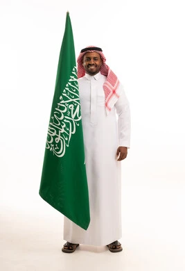 Saudi Man Holding National Flag on White Background