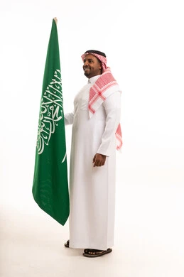 Traditional Saudi Man with National Flag on White Background