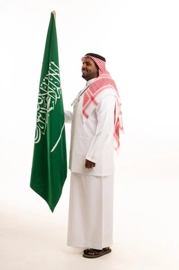 Saudi Doctor Holding National Flag in Studio