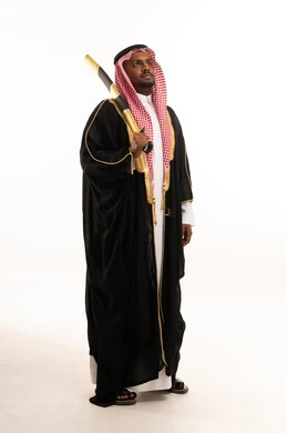 Saudi Man in Traditional Bisht Holding Ceremonial Sword