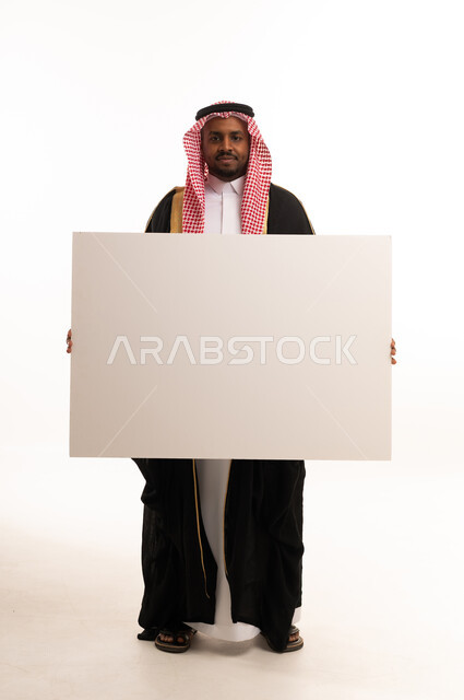 Saudi Man Holding Blank White Poster Board in Bisht
