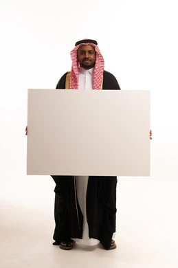 Saudi Man Holding Blank White Poster Board in Bisht
