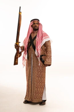 Saudi Man in Traditional Heritage Costume with Rifle