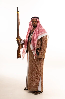 Saudi Man in Traditional Heritage Clothing with Rifle