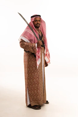 Saudi Man in Traditional Dress Holding Sword