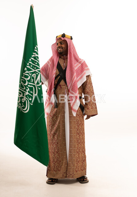 Saudi Man with National Flag in Traditional Daqlah