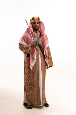 Saudi Man in Traditional Ardah Folk Costume with Sword