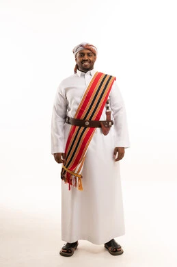 Omani Man in Traditional Dress with Khanjar and Mussar