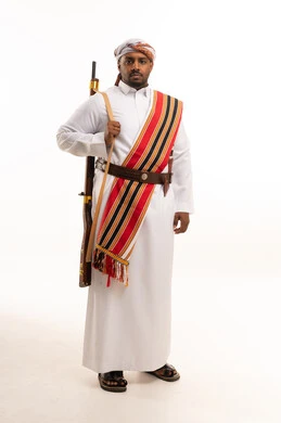 Omani Man in Traditional Dress with Rifle