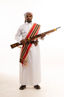 Saudi Man in Traditional Ardah Clothing with Rifle