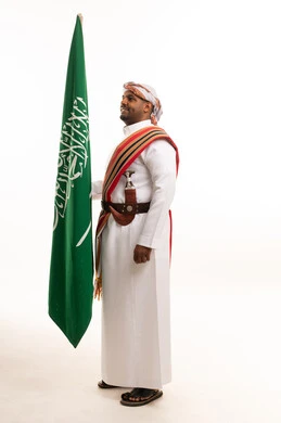 Saudi Man in Southern Traditional Dress with Flag
