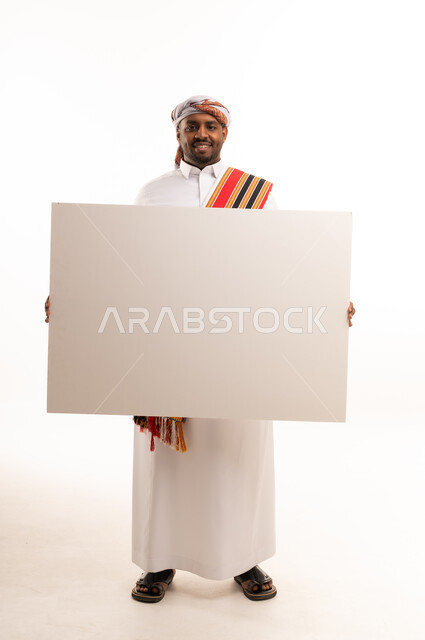 Omani Man in Traditional Dress Holding Blank White Board