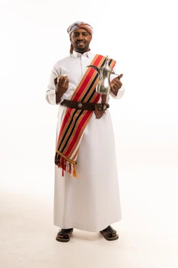 Omani Man in Traditional Dress with Arabic Coffee Pot