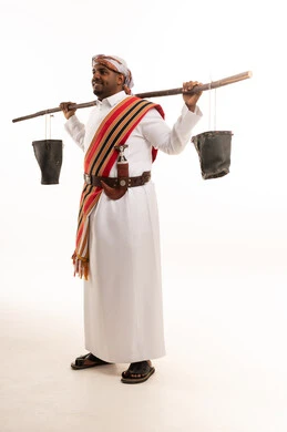 Omani Man in Traditional Dress with Khanjar and Buckets