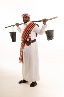 Omani Man in Traditional Dress with Wooden Yoke