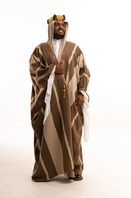 Saudi Man Wearing Traditional Winter Farwa in Studio