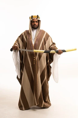 Saudi Man in Traditional Bisht Holding Ceremonial Sword