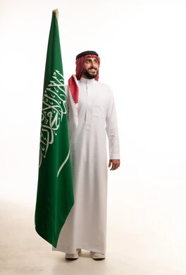 Saudi Man in Traditional Thobe with National Flag