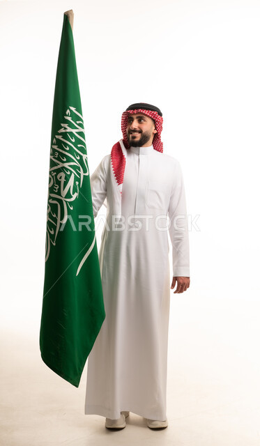 Saudi Man Holding National Flag on White Background