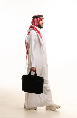 Saudi Businessman Walking with Laptop Bag on White