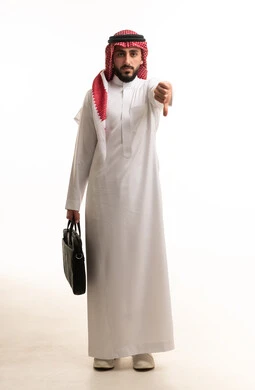 Saudi Businessman with Briefcase Making Thumbs Down Sign