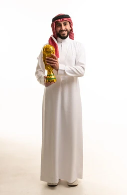 Saudi Man Holding Gold Trophy in White Studio
