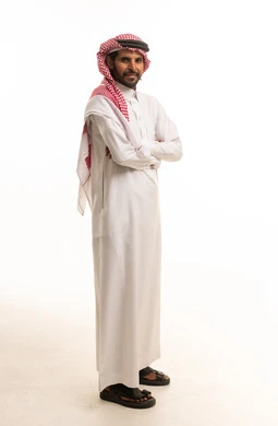 Saudi Man in Traditional Thobe and Shemagh Standing