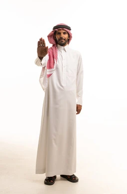Saudi Man in Traditional Thobe Making Stop Gesture