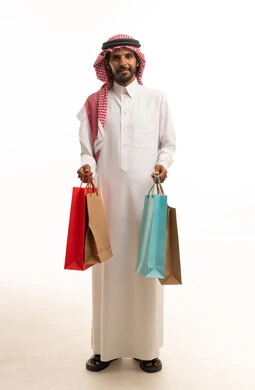 Saudi Man Holding Shopping Bags on White Background