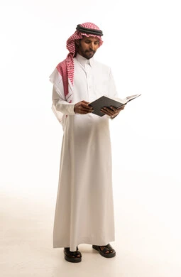 Saudi Man in Traditional Thobe Reading a Book Studio