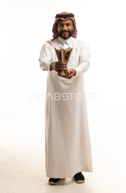 Saudi Man in Traditional Thobe Holding Incense Burner