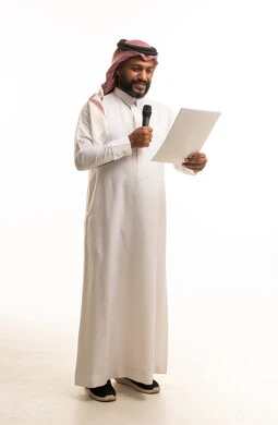 Saudi Man Reading Speech with Microphone in Studio
