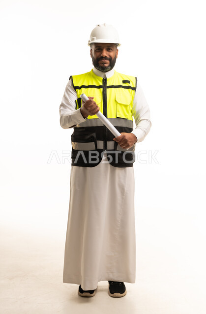 Saudi Male Engineer Holding Blueprint in Studio