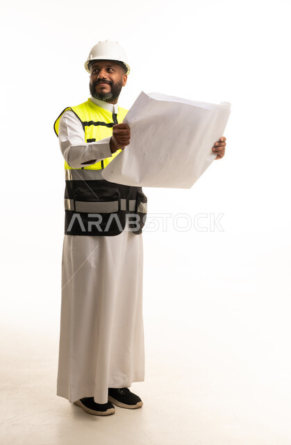 Saudi Engineer Holding Construction Blueprint Plans