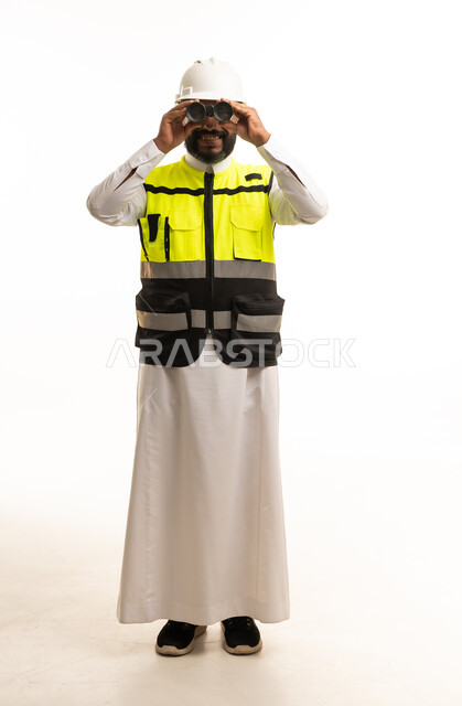 Saudi Engineer in Safety Vest Looking Through Binoculars