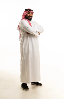Saudi Man in Traditional Thobe and Shemagh Standing