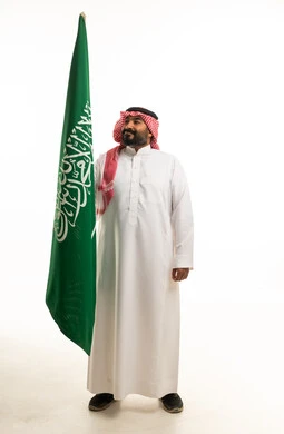 Saudi Man with Saudi National Flag on White Background