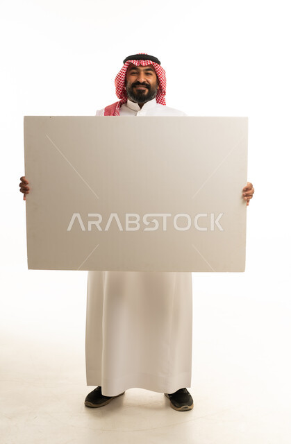 Saudi Man Holding Large Blank White Board in Studio Shot