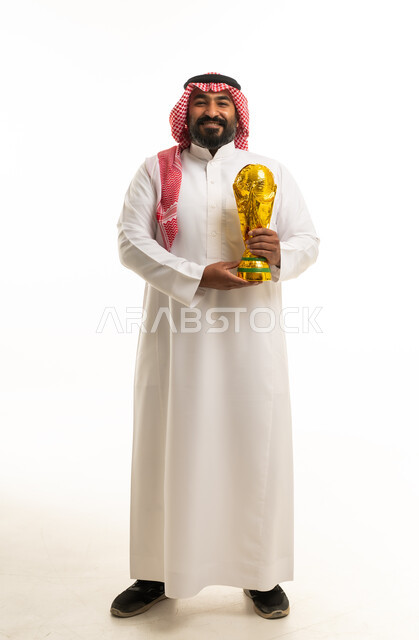 Saudi Man Holding Gold World Cup Trophy Studio Shot