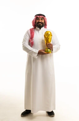 Saudi Man Holding Gold World Cup Trophy Studio Shot