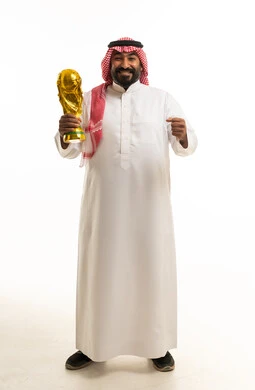 Saudi Man Holding Gold Trophy on White Background