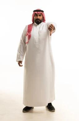 Saudi Man in Traditional Thobe Giving Thumbs Down