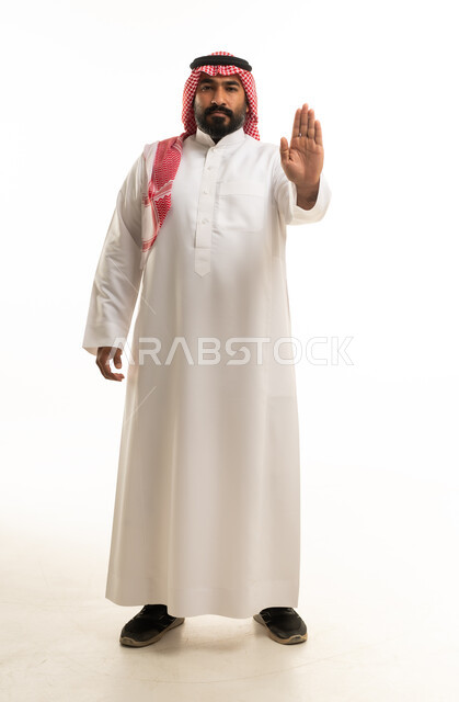 Saudi Man in Traditional Thobe Making Stop Gesture