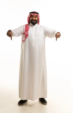 Saudi Man in Traditional Dress Pointing Downward Studio