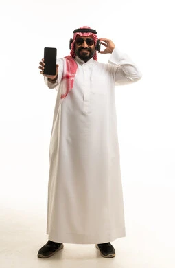 Saudi Man with Headphones and Smartphone on White Background